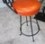 Late 20th Century Vintage Spanish Revival Wrought Iron Swivel Bar Stool Set With Matching Mesh Bar Table & Heavy Umbrella Stand – Mid-Century, Orange Vinyl For Sale - Image 5 of 12