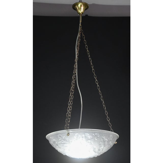 Art Deco style glass chandelier with floral motif. Produced in 1950. The chandelier is in perfect vintage condition, still...