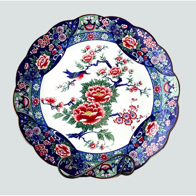 Mid to Late 20th Century Japanese Floral and Bird Charger, measuring 13 inches. This vibrant large plate features a...