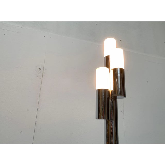 Rare space age table lamp. A simple design with a mirrored chrome finish. The lamp body consists of a combination of three...