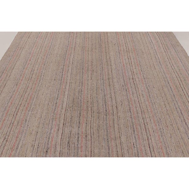 Handwoven in wool, this 9x10 vintage Persian kilim is a sophisticated addition to Rug & Kilim’s Kilim & Flatweave...