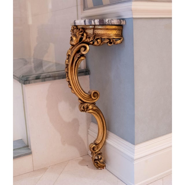 Age: 80 years old Details: Stunning gold finish Beveled edge marble top Ornate carved wood base Italian made and design...