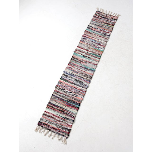 This narrow, long vintage rag weave runner adds textured warmth to farmhouse, cottage, or primitive style spaces....