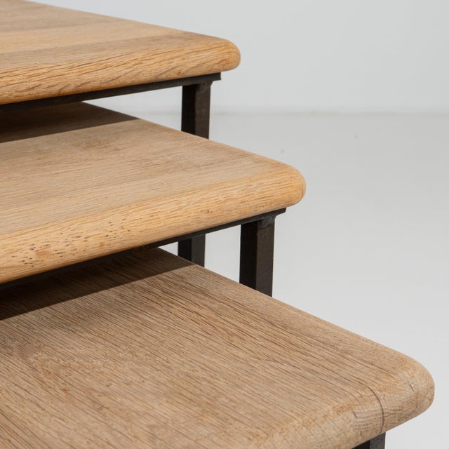 Originating from France circa 1970, this distinguished set of three nesting tables exemplifies the enduring appeal of...