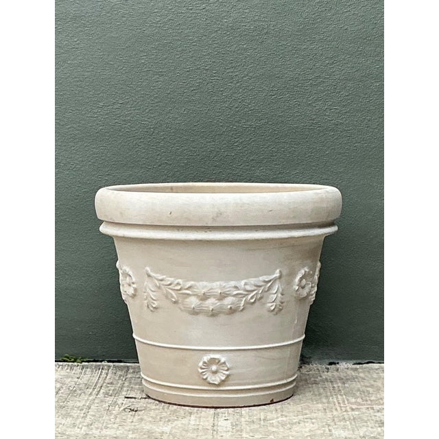 This vintage Italian terracotta planter embodies the enduring beauty of classical Mediterranean design, blending...