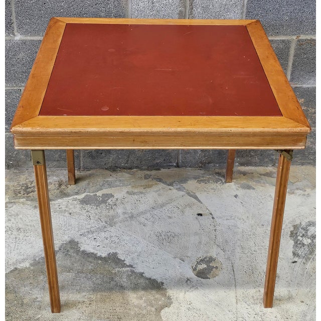 A 1950s Leg-O-Matic Maple and Vinyl top Folding Card Table. Great patina with no tear. Measures 29.25 " in width, 29.25"...