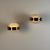 An exceptional pair of wall sconces from the iconic "Gamma" series, designed by Sergio Mazza for Artemide in the 1960s....