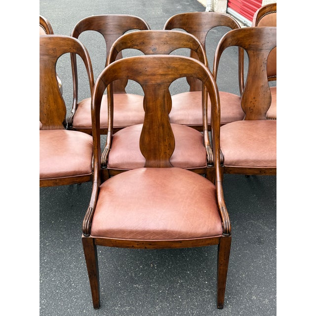Exquisite set of dining chairs by Walter E Smithe . Features antique French Empire styling , solid wood frames with rustic...