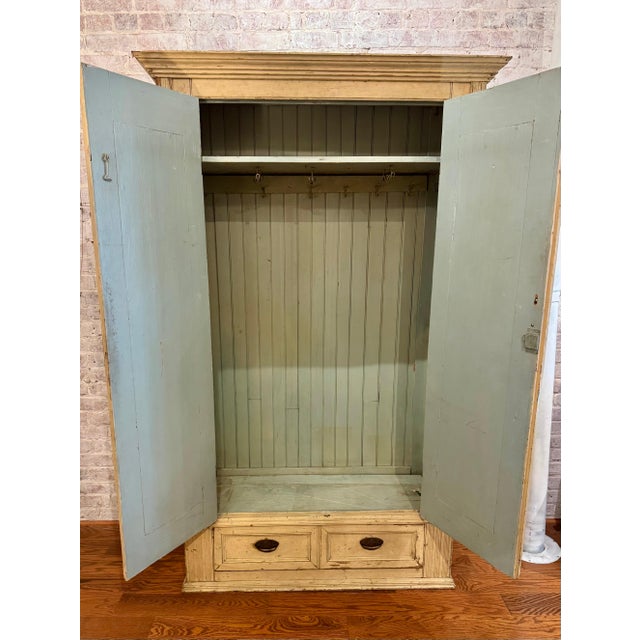 Standing 81.5" tall and measuring 46" wide by 18" deep, this Antique Rustic Painted Wardrobe boldly transforms any space...