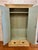Standing 81.5" tall and measuring 46" wide by 18" deep, this Antique Rustic Painted Wardrobe boldly transforms any space...