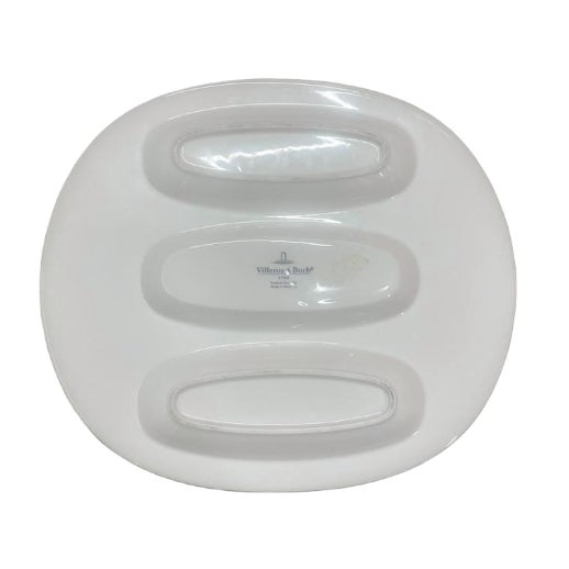 This sleek and highly collectible three-section serving platter from the renowned German ceramics house, Villeroy & Boch...
