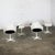 Awesome Mid-20th Century Mid Century Modern Tulip chairs by Burke comprised of a white fiberglass armed shell or frame,...