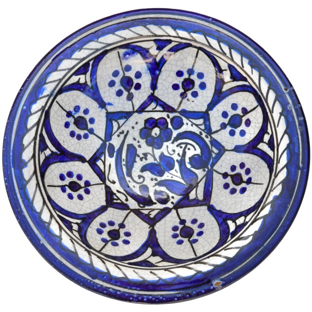 This spectacular ceramic plate has the kind of traditional charm that's right at home in any aesthetic from Southern...