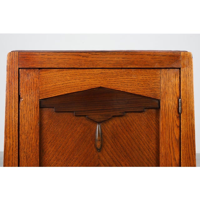 A beautifully crafted Amsterdamse School cabinet dating to around 1915, showcasing the expressive geometry, rich...