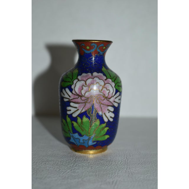 Vintage (1980's) Mini Vase is Chinese. Cloisonné - Multi-Colored with Floral Designs. The Measurements: 2"Diam. x 3"H....