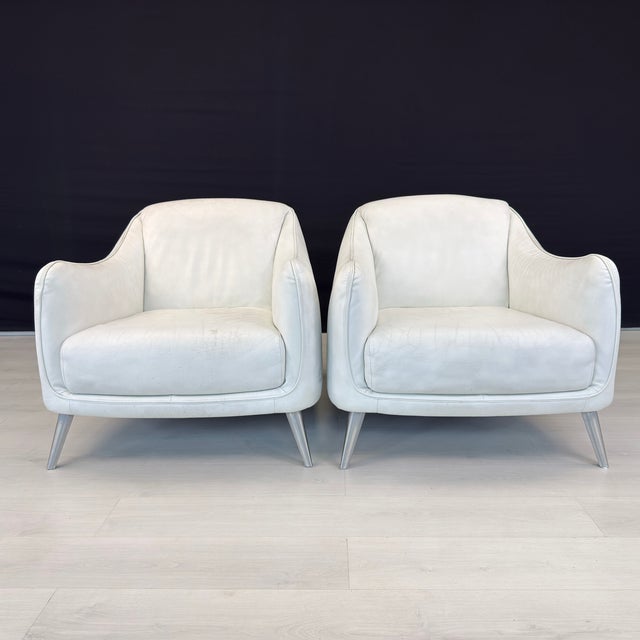Dimensions: H 31.5” x W 30” x D 37” x SH 17” Pair of Italian white leather Platea armchairs designed by Natuzzi Italia in...