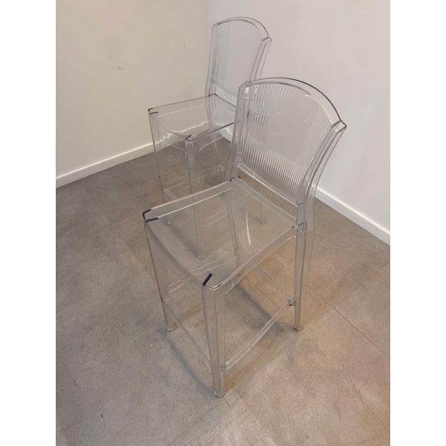 Elegant transparent bar stool by Dibi, crafted from durable clear acrylic/polycarbonate. Its minimalist design and...