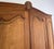 Vintage Louis XVI French Four Door Oak Carved Armoire For Sale - Image 5 of 12
