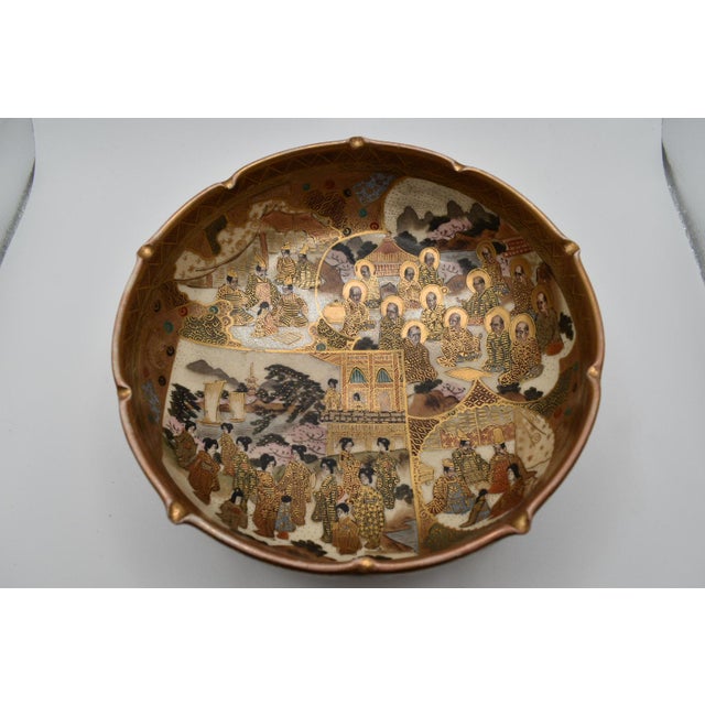 This is a beautiful Japanese Satsuma bowl. It is from the Meiji period (1868-1912). It depicts Monks and females throughout.