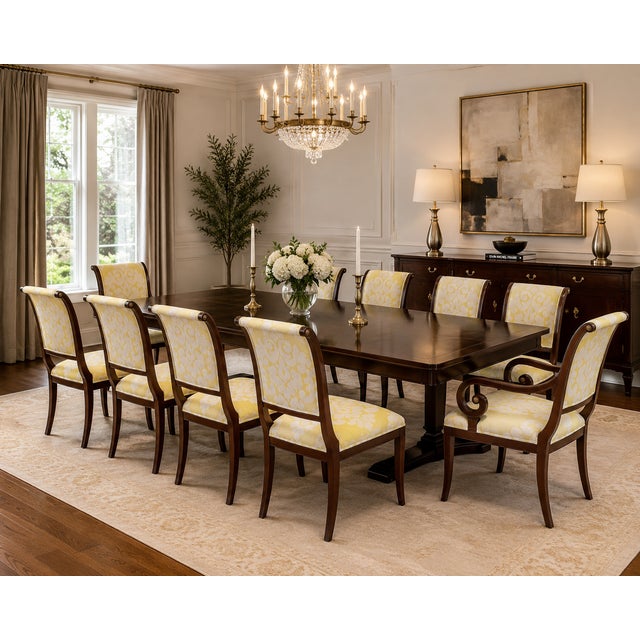 An exceptional set of ten Kindel dining chairs showcasing elegant neoclassical styling with beautifully sculpted...