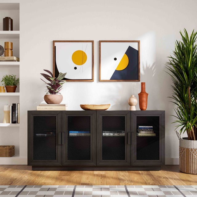 The Nolan Black Wood Console is a stunning piece of furniture with a sleek, contemporary design featuring a black wood...