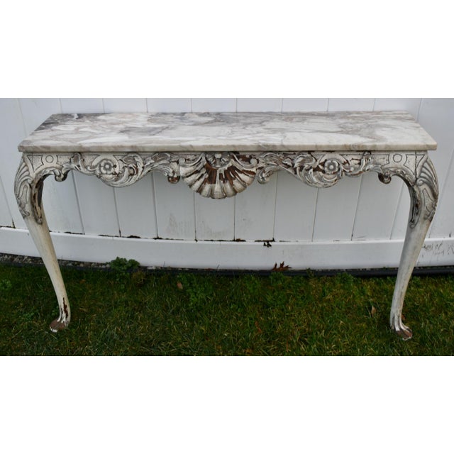 Vintage (1950's) Wall Console Table has a Venetian Style. The Frame is Wood. Carved Walnut. Distressed Antique White...