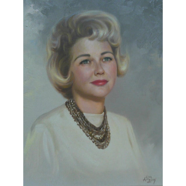 A beautifully executed mid‑century oil portrait depicting a poised woman with classic 1960s elegance. The sitter’s soft...