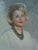 A beautifully executed mid‑century oil portrait depicting a poised woman with classic 1960s elegance. The sitter’s soft...