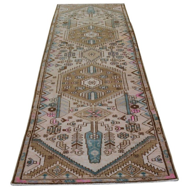 Hand-knotted with care using traditional rug-making techniques, this wool rug blends timeless craftsmanship with a modern...