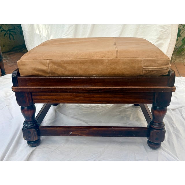 This vintage Ethan Allen tavern-style footstool beautifully highlights the brand's classic American craftsmanship. Built...