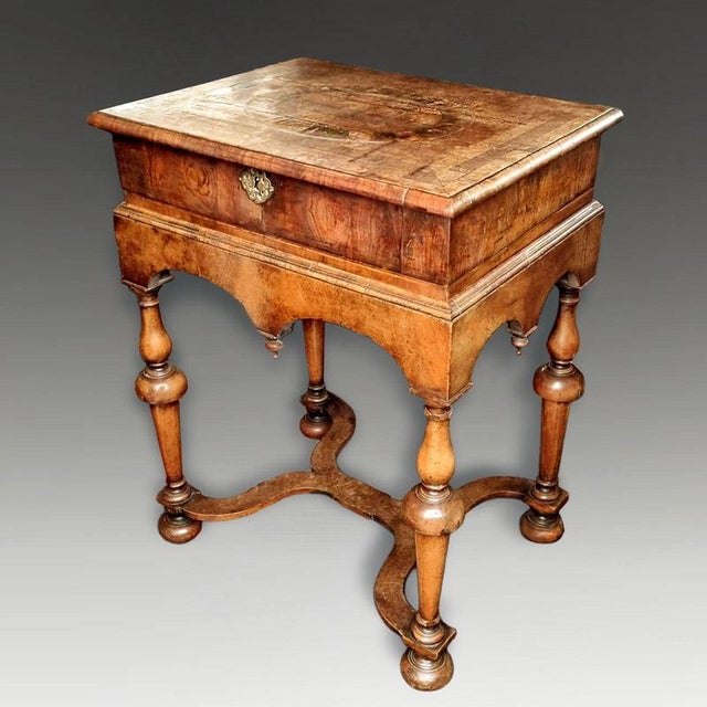 A rare late 17th-century English box on stand dating to circa 1680 and richly veneered in walnut and laburnum oyster-cut...