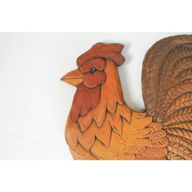 Vintage hand carved wooden rooster wall hanging. Signed by artist on back, dated 1989. Ready to hang. Minimal signs of wear.