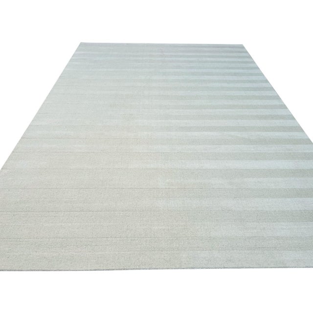 Yara Alluring Black & White Handmade Wool Rug, Country of Origin: India. This piece exemplifies the refined quality of...