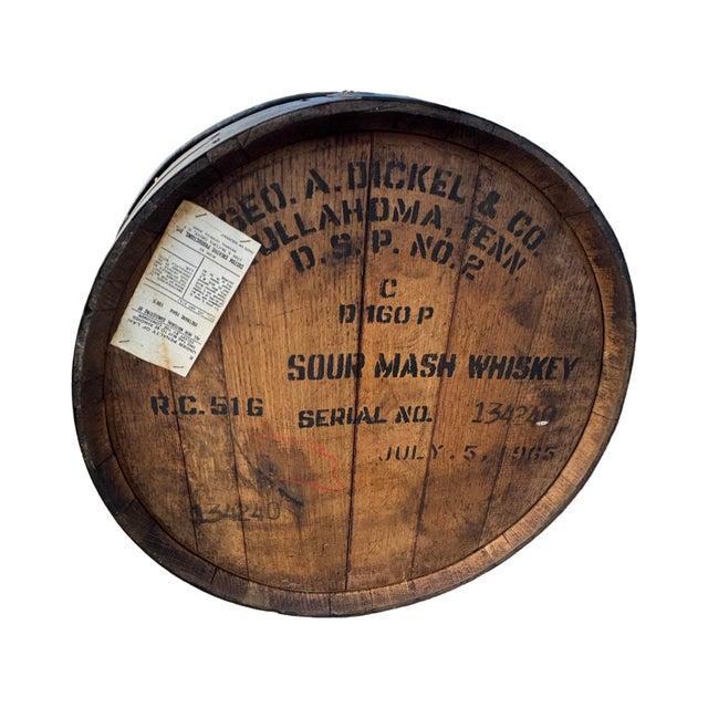 Vintage ottoman made from a Sour Mash whiskey barrel. Authentic barrel made of wood and metal with Naugahyde leather...
