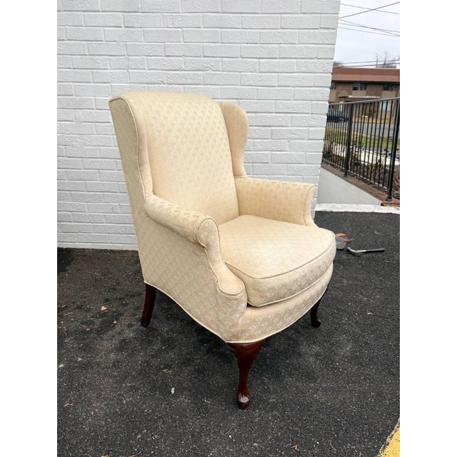 Pair of Queen Anne Style Upholstered Wingback Arm Chairs Frame is sturdy . Fabrics is old and will be beneficial if you...