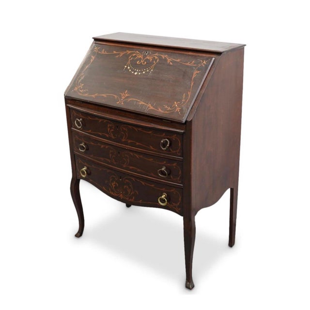 Antique French wood secretaire desk featuring hinged writing top inlaid with mother of pearl and marquetry foliage around...