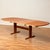 The dining table was manufactured in Denmark in ca. 1980s, by Gangsø. It is made of solid cherry wood on the structure and...