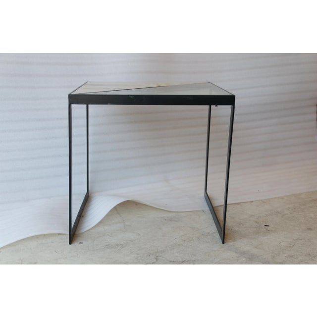 This unconventional side table has an angle on style Its unique tabletop has a two-toned design that runs corner to corner...