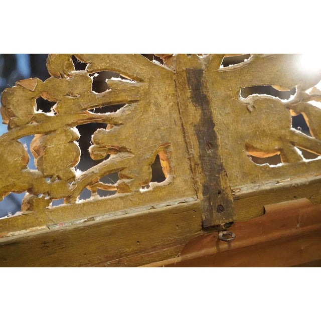 This stunning mid-19th century European giltwood mirror with its excellent gilded surface showcases exceptional hand-...