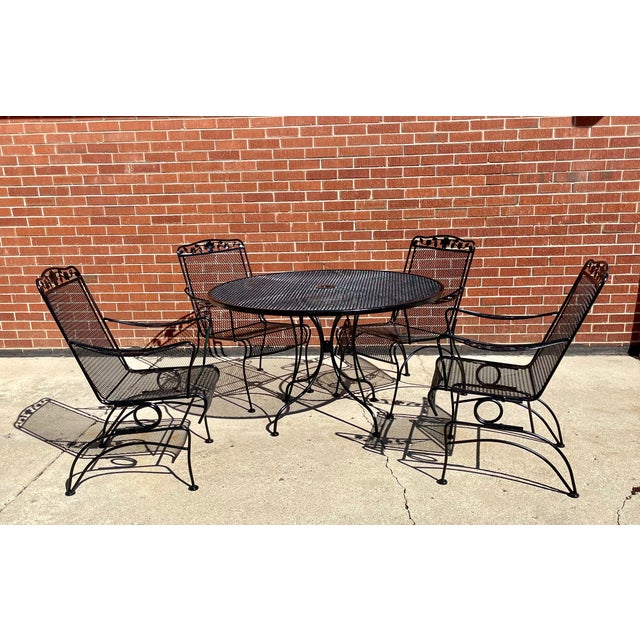 This piece set includes 4 chairs.. 2 Are spring Rockers and 2 are stationary. The 2 Stationary have different bases and...