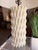 This modern sculptural table lamp makes a sophisticated statement with its striking geometric silhouette and tactile...