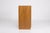 Scandinavian teak sideboard on a plinth, featuring six drawers on the left and a compartment with a door on the right....