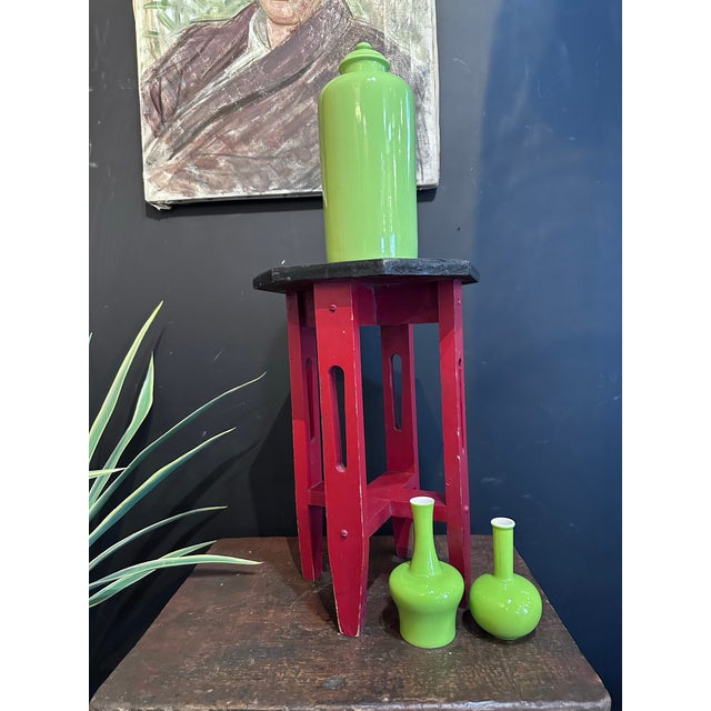 Octagon side table painted red and black. Arts and craft style. Great little piece for a moving around the house were...