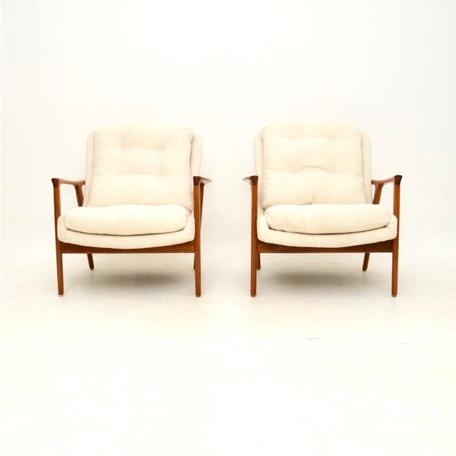 An absolutely stunning pair of Swedish vintage walnut armchairs by Inge Andersson for Broderna Andersson. We have recently...