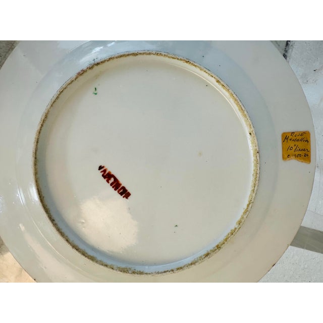 This is a vintage Rose Medallion porcelain plate, a style of Chinese export ware that was popular in the 19th and early...