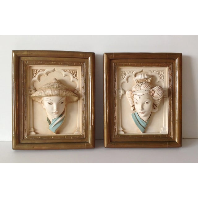 Vintage, circa 1950's, Asian pair of plaster, 3-dimensional, 3-d, wall relief art by the Alexander Production Co. There is...