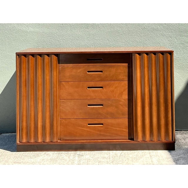This Edward Wormley for Dunbar sideboard is a quintessential example of mid-century modern sophistication. Celebrated for...