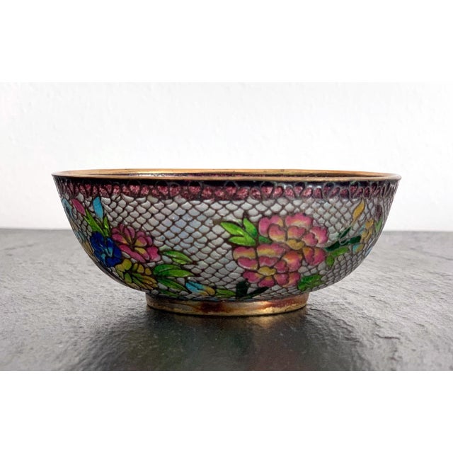 A small Chinese cloisonne enamel bowl made with the technique of Plique-a-jour (means "letting in daylight" in French), a...