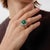 This vintage emerald and diamond cocktail ring is a commanding expression of color, scale, and refined glamour. At its...
