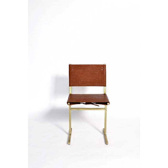 Classic brown and brass memento chair, jesse sanderson original signed chair by jesse sanderson materials: leather, steel...